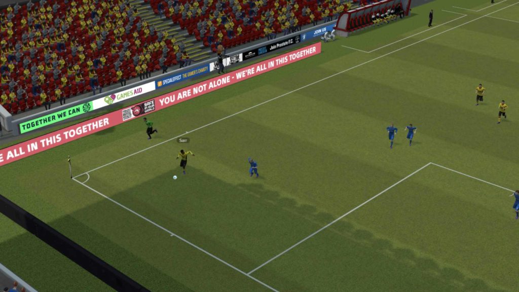 screenshot from FM23, with pitchside banners reading 'you are not alone - we're all in this together' with SIOW logos